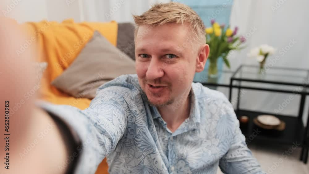 Handsome man making online streaming at home with camera for personal blog. Guy recording vlog video content for social media Handsome man making online streaming at home with camera for personal blog. Guy recording vlog video content for social media