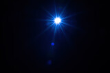 Light star illuminated on a black background.