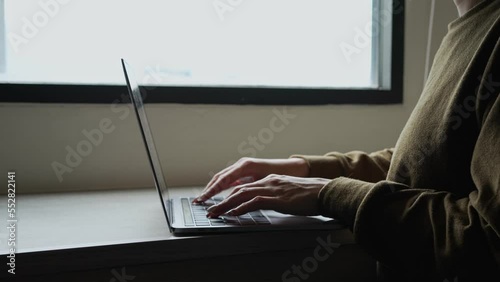 Woman uses modern laptop touchpad or trackpad with her hand. For search data on internet. work from home concept.