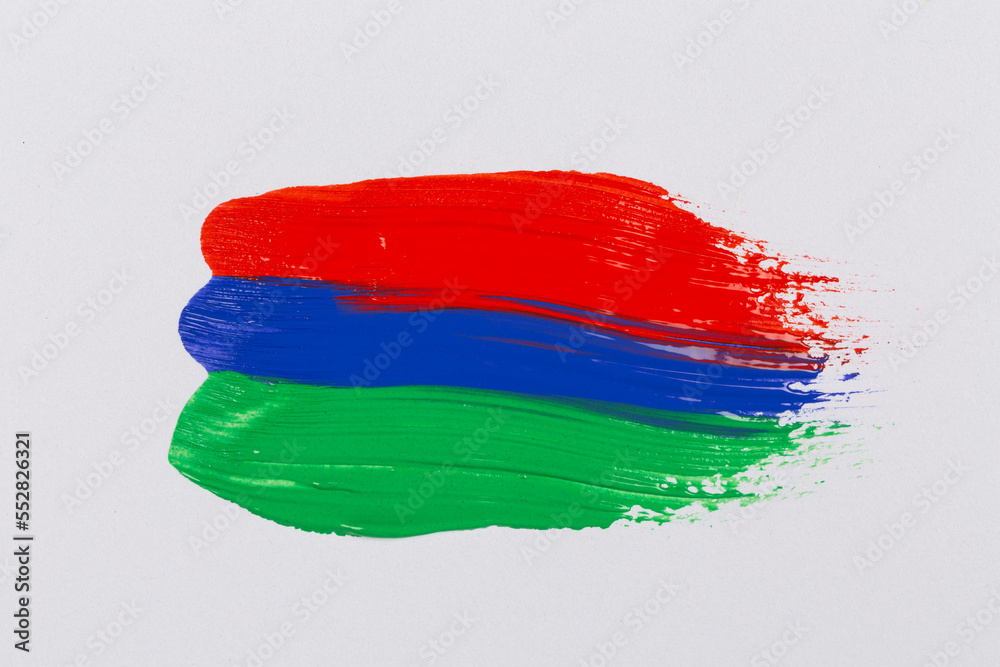 Obraz premium Acrylic green blue red paint on white paper