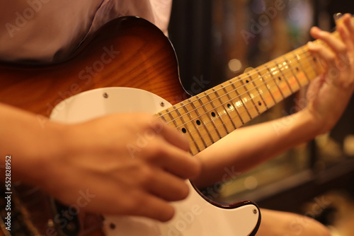 close up asia youth playing beautiful telecaster guitar