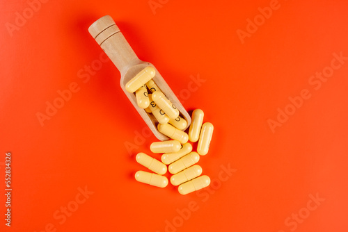 medicinal prescribed pharmaceutical controlled drugs hard capsules isolated on an orange background