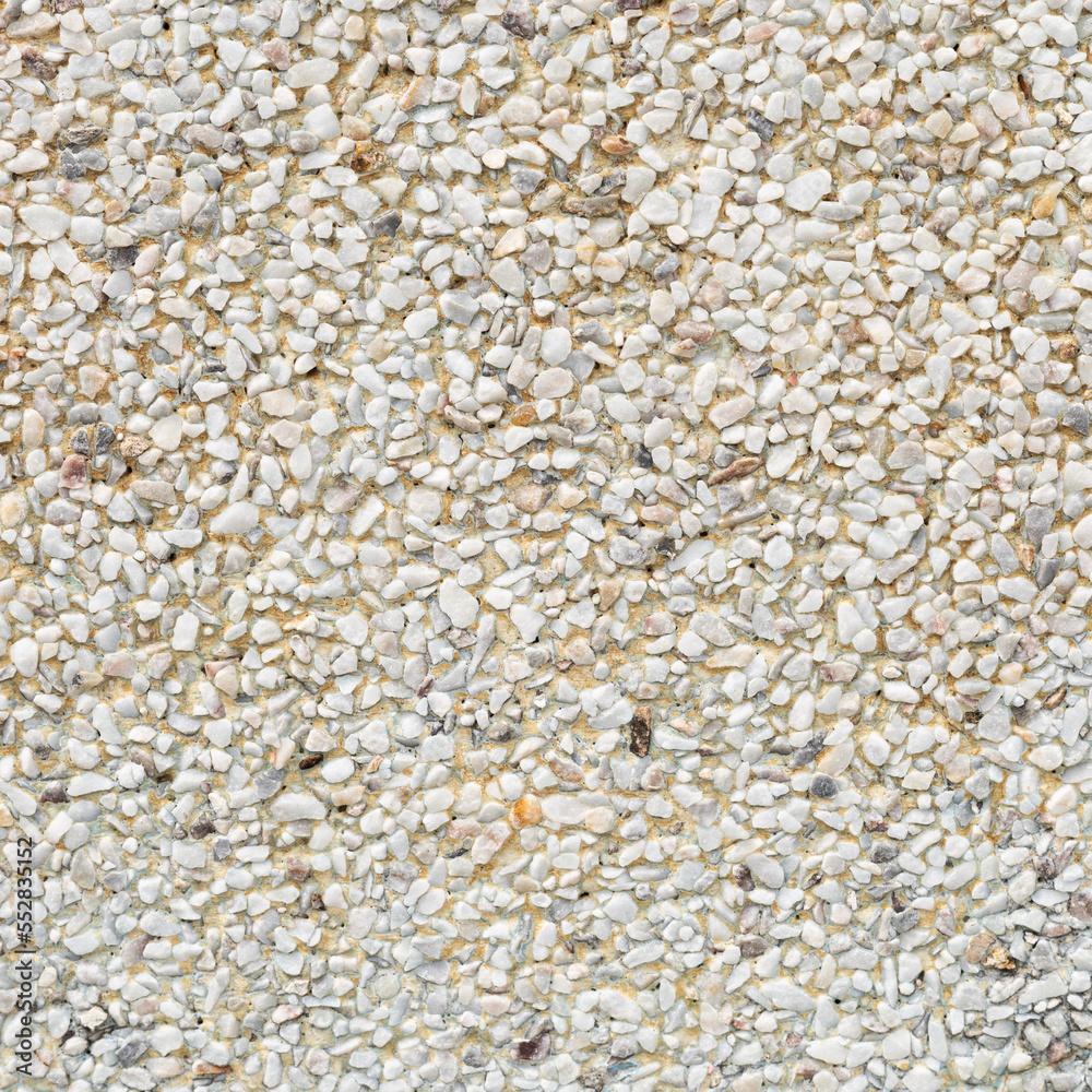 The pattern yellowish white white pebbles stone as background. pebbles texture wall and floor. The pattern yellowish white white pebbles stone as background. pebbles texture wall and floor.