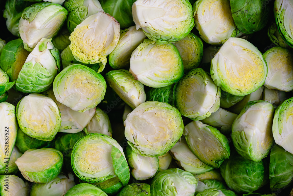 Closeup View of Raw Trimmed and Halved Brussels Sprouts: Close up of uncooked Brussels sprouts that have been cut in half Closeup View of Raw Trimmed and Halved Brussels Sprouts: Close up of uncooked Brussels sprouts that have been cut in half