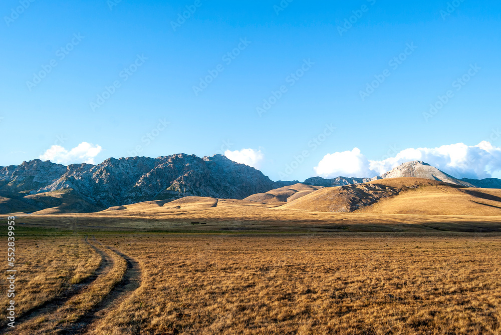 Panoramic view of Campo Imperatore, the largest plateau of the Apennines located in the Gran Sasso and Monti della Laga National Park, province of L'Aquila, Abruzzo region, Italy.
