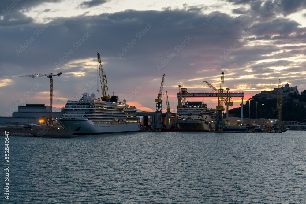 dockyards with cruise ships under construction in the harbor of Ancona at sunrise dockyards with cruise ships under construction in the harbor of Ancona at sunrise