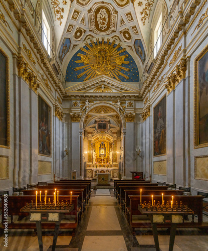 interior view of the side chapel in the Spoleto Cathedral with the altar and painted ceiling