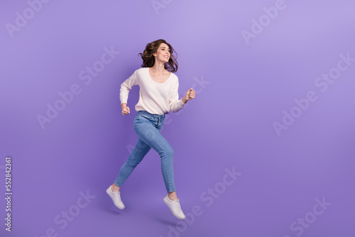 Profile side full length photo of sporty lady hurry black friday total sale offer deal look empty space isolated on purple color background