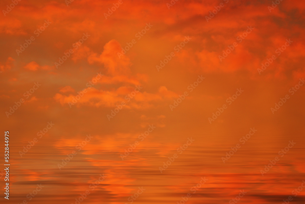 sea water surface with scarlet clouds at sunset
