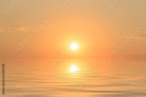 water surface with sun and clouds at sunset
