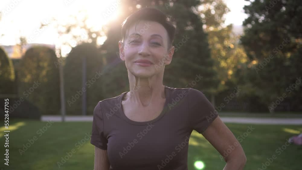 Portrait of a modern active mature woman in a park outdoors Portrait of a modern active mature woman in a park outdoors