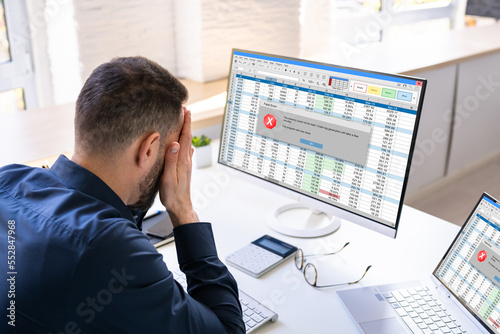 Worried Man At Computer With System Failure Screen