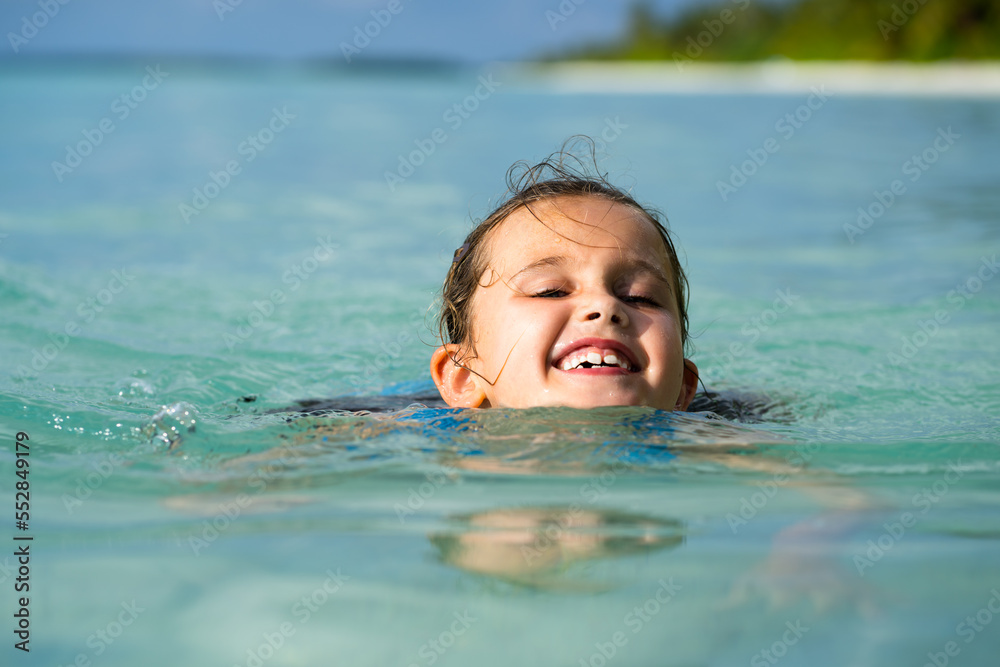 Kid Learning Swimming With Swimming Disc Or Ring