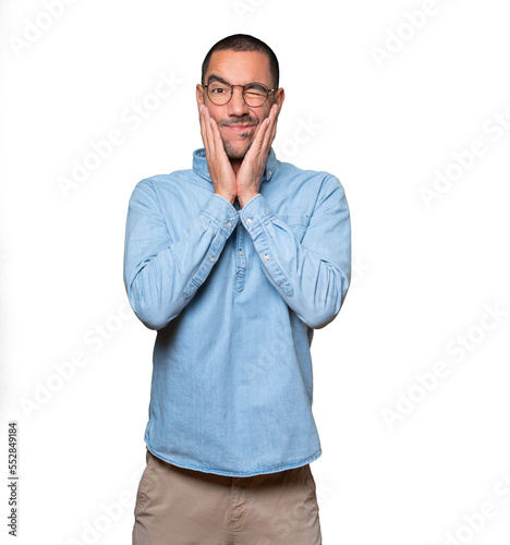 Concerned young man doing a gesture of relief