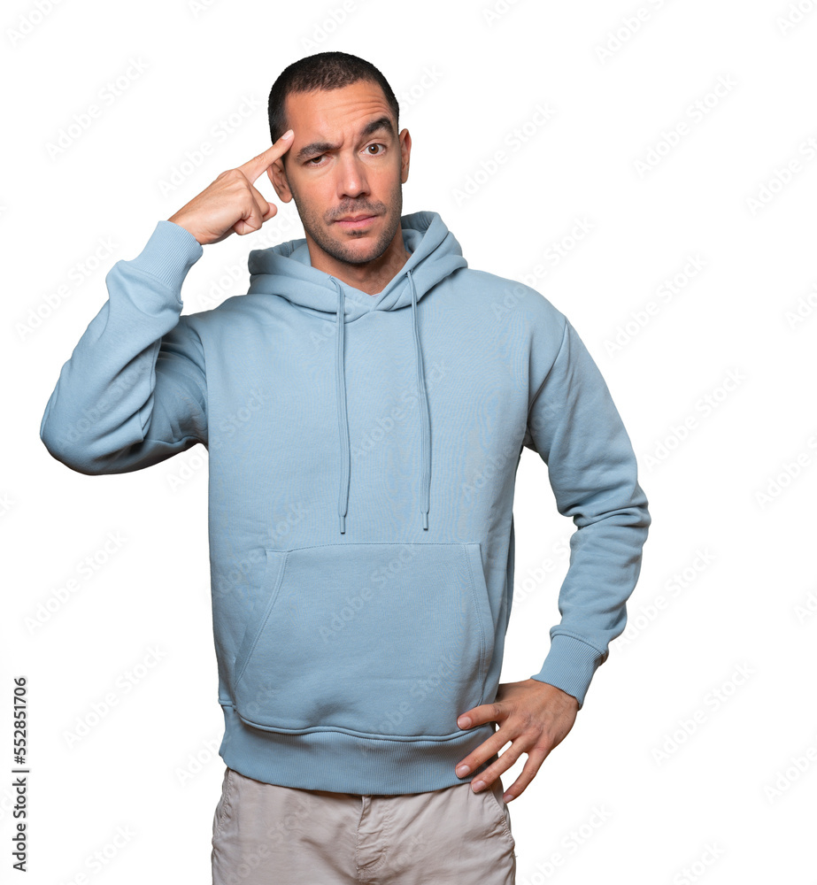 Serious young man doing a gesture of concentration
