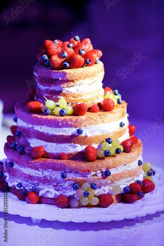 Children's birthday cake with fruit and cream.