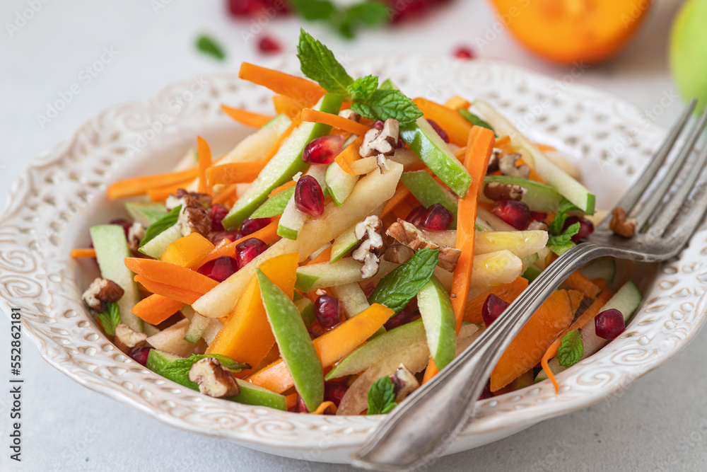 Carrot,quince,persimmon and apple salad with dressing. Carrot,quince,persimmon and apple salad with dressing.