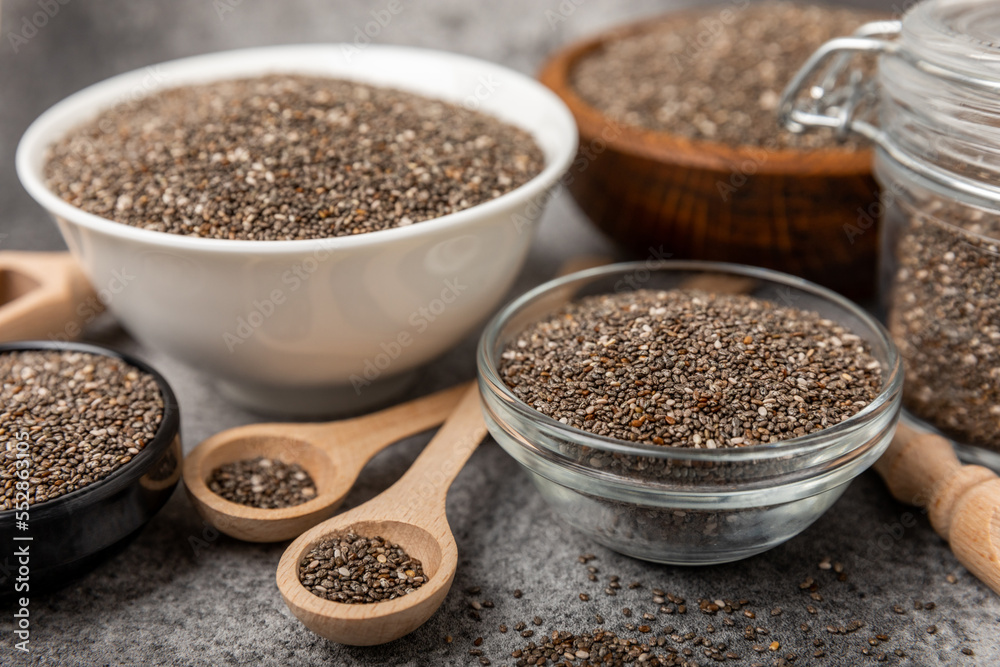 Bowl and spoon with chia seeds, closeup.Superfood. Healthy food. Diet. The concept of proper nutrition. antioxidant. Place for text, space for copy. Bowl and spoon with chia seeds, closeup.Superfood. Healthy food. Diet. The concept of proper nutrition. antioxidant. Place for text, space for copy.