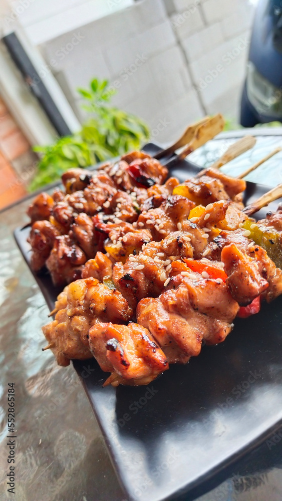 A plate of homemade Japanese 'Yakitori', in one serving there are six skewers A plate of homemade Japanese 'Yakitori', in one serving there are six skewers