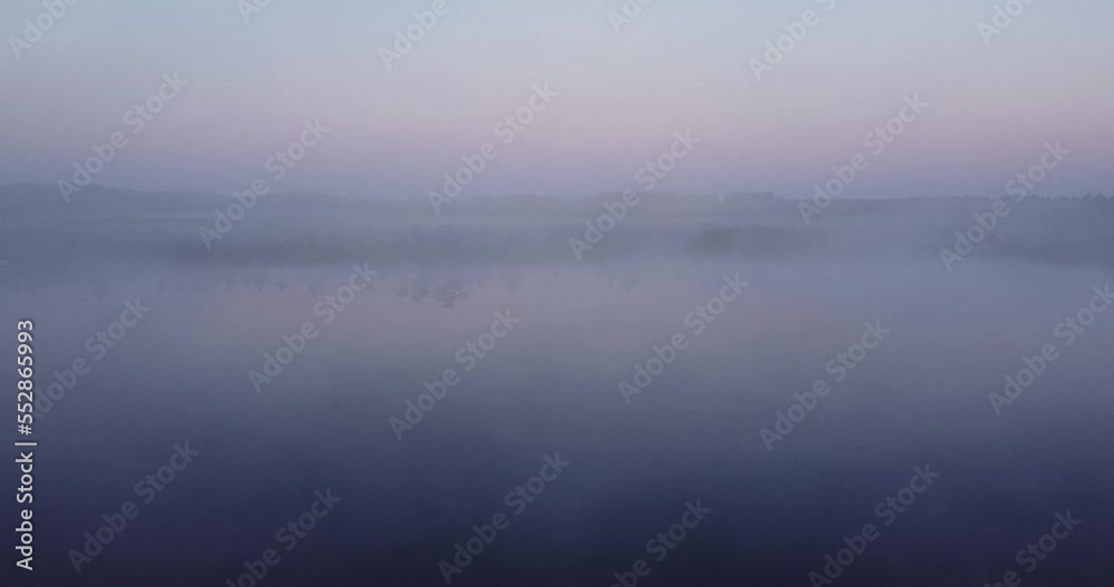 Sunrise in the misty forest, fog morning over the plain and lake floodplain in the meadow. Sunrise in a bog, wetland. Sunrise through fog. Calmness, relaxation, meditation, beauty of nature concept Sunrise in the misty forest, fog morning over the plain and lake floodplain in the meadow. Sunrise in a bog, wetland. Sunrise through fog. Calmness, relaxation, meditation, beauty of nature concept