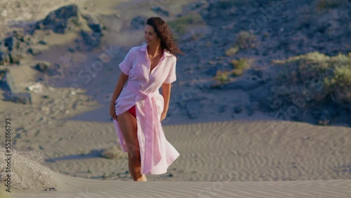 Wallpaper Mural Walk in the desert. The girl is walking goes to the camera, the feet sink in the sand. Hot sand. Walk in the desert. Women's feet sink in the sand Torontodigital.ca