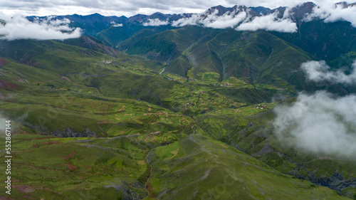 mist-shrouded mountains. High mountain complex. Fog in the morning and evening Tibet.