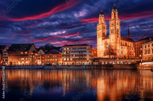The church Grossmunster. Zurich. Switzerland. Cityscape image of Zurich with colorful sky, during dramatic sunset. Popular travel destination © jenyateua