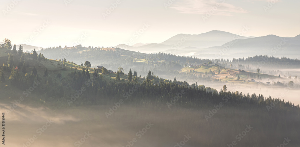 Beautiful sunrise over the mountain range. panorama of countryside during sunset under sunlight. wonderful autumn landscape in highlands. Picture of wild area. Awesome nature Background. retro style