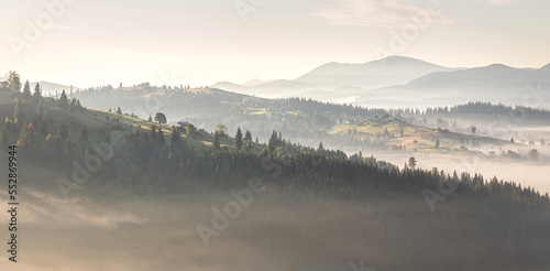 Beautiful sunrise over the mountain range. panorama of countryside during sunset under sunlight. wonderful autumn landscape in highlands. Picture of wild area. Awesome nature Background. retro style