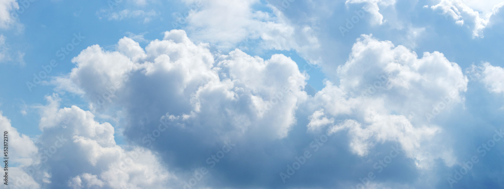 Sunlit white clouds in the blue sky Sunlit white clouds in the blue sky