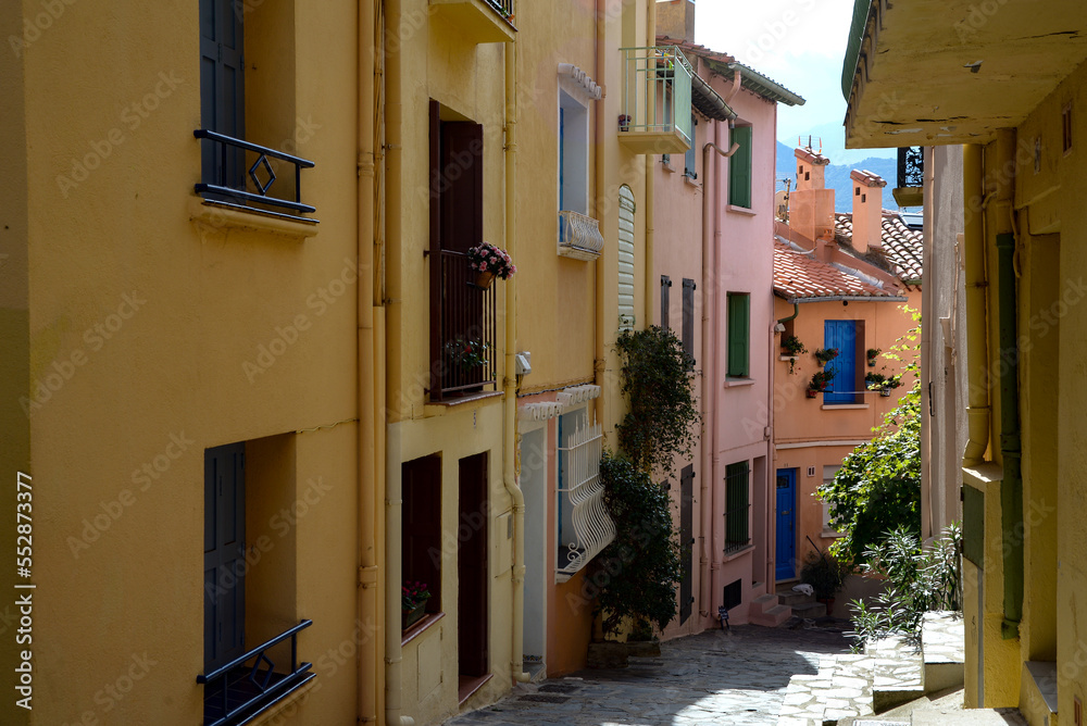Street of a mediterranean town. Multicolored houses. Narrow street.