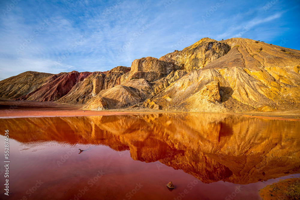 Mining landscape of Mazarrón, Murcia, Spain, where a red puddle can be seen due to the iron from the extracted minerals