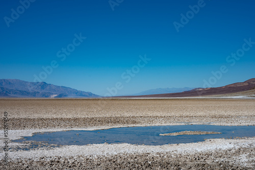 Detail of a puddle or water mirage in the hot Mojave desert
