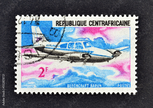 Cancelled postage stamp printed by Central African Republic; that shows Airplane Beechcraft Baron, circa 1967. photo