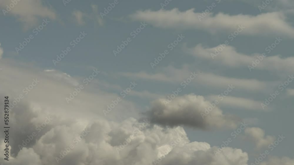 Building up of cumulus clouds in light blue grey sky 4K timelapse Building up of cumulus clouds in light blue grey sky 4K timelapse