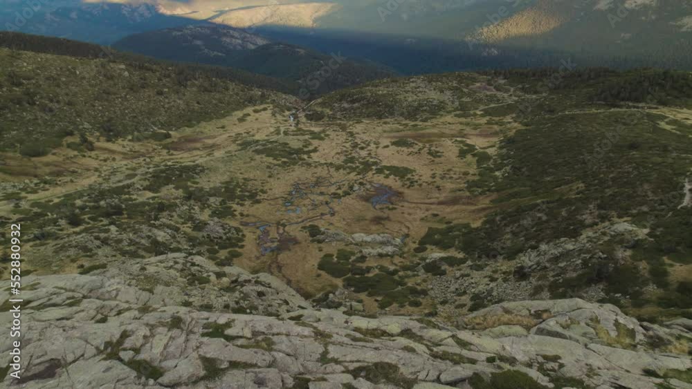 Aerial shot revealing mountains in Sierra de Gredos, Guadarrama (a mountain range of the Sistema Central between Madrid and Segovia, Spain), near Puerto de Cotos and Peñalara. Sky view of the Valley.