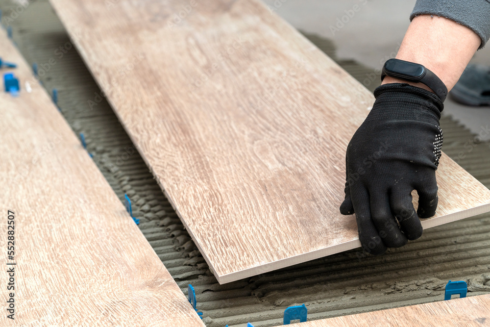 Laying tiles in the bathroom or kitchen