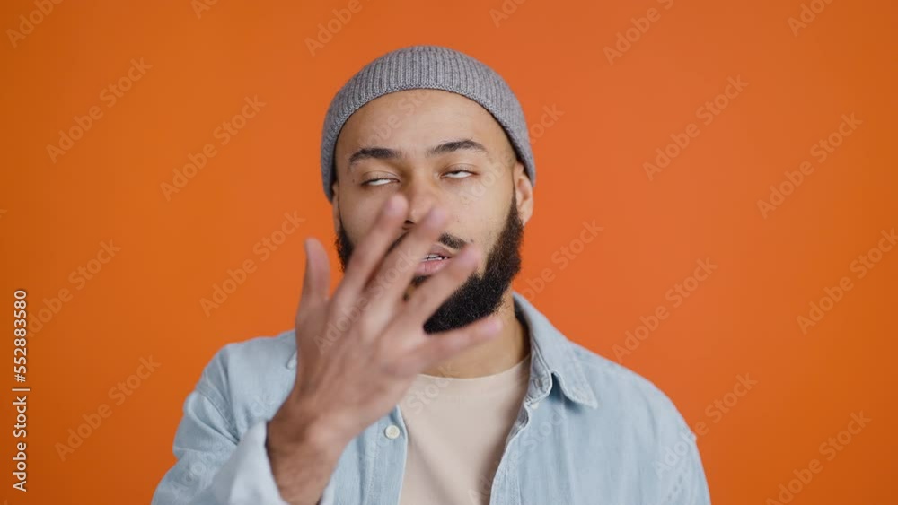 African American man presses palm to face with annoyance African American man presses palm to face with annoyance