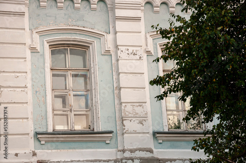 Old city buildings with ancient windows, roofs, balconies. sculptures, walls 