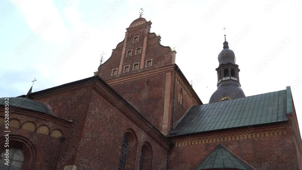 Low-angle view of Riga Dome building - the Evangelical Lutheran Cathedral Church of Saint Mary in Riga, Latvia. The first central cathedral in the Baltics that a foundation stone was laid in 1211. Low-angle view of Riga Dome building - the Evangelical Lutheran Cathedral Church of Saint Mary in Riga, Latvia. The first central cathedral in the Baltics that a foundation stone was laid in 1211.