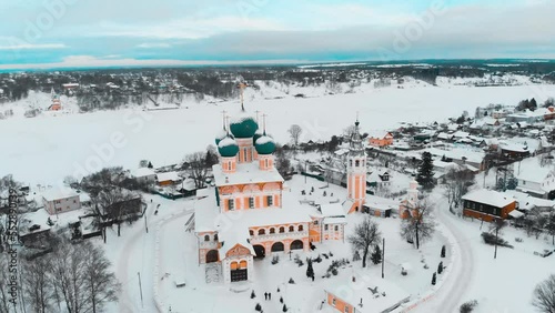 frozen river and temple in winter, drone photo