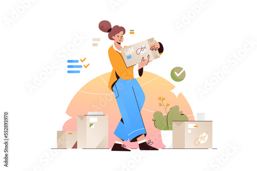 Young woman holding large cardboard box