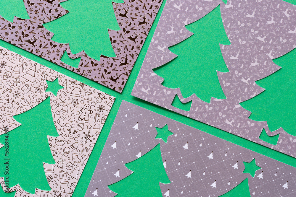 Fototapeta premium four stencils with stylized paper holiday tree cutouts