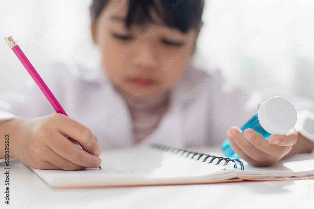 education, science, chemistry and children concept - kids or students with test tube making experiment at school laboratory education, science, chemistry and children concept - kids or students with test tube making experiment at school laboratory