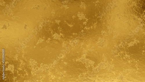 Shiny wrinkled gold foil texture. Scratched metal background. photo