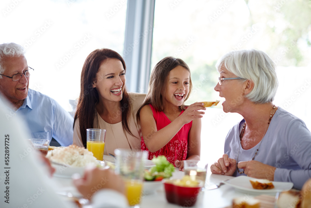 Food tastes better when you eat it with family. Shot of a happy multi-generational family having a meal together.
