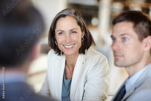 She always has time for her employees. A cropped shot of a happy businesswoman talking to colleagues at work.