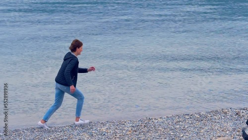 matherhood, love -little  girl runs towards her mother who takes her in her arms photo