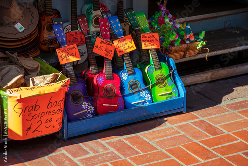 tiny colorful toy guitars in a bin for sale at Olvera Street in Los Angeles California USA photo