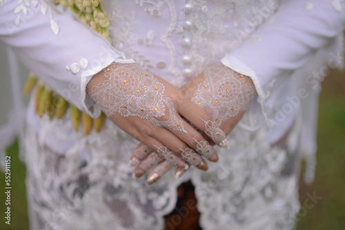 Indonesian Wedding Close up on Hand With White Henna